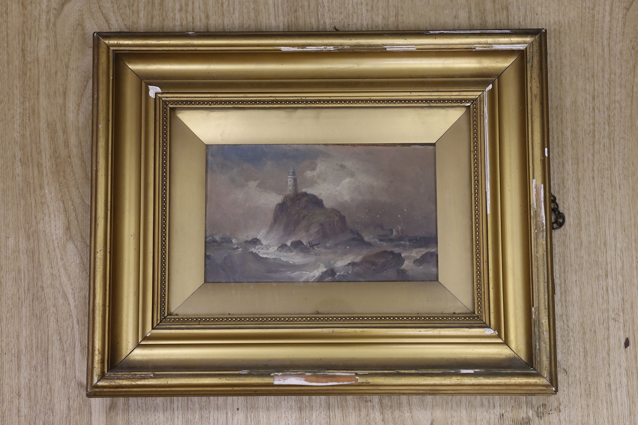 English school, c.1900, oil on board, lighthouse amongst rough seas, 12 x 20cm